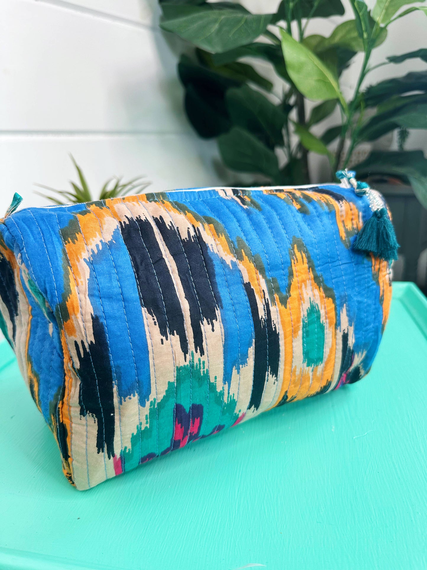 QUILTED TOILETRIES BAG: BLUE IKAT