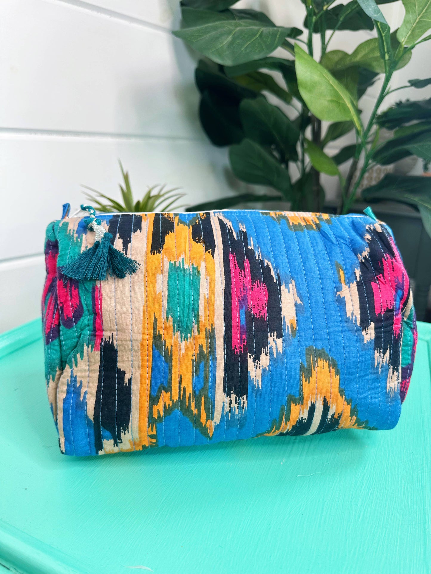 QUILTED TOILETRIES BAG: BLUE IKAT